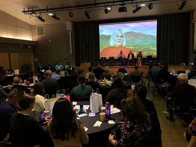 Attendees watching May Mental Health Forum event