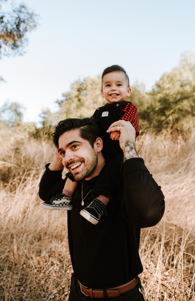 Dad with son on his shoulders