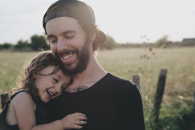 Dad laughing with his daughter